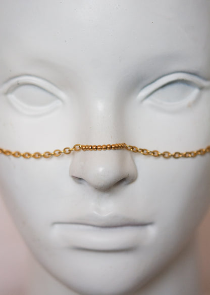 Bijou facial acier inoxydable doré, vibe mystique. Style serpent, chaos sacré, accessoire rituel, costume ou photoshoot.