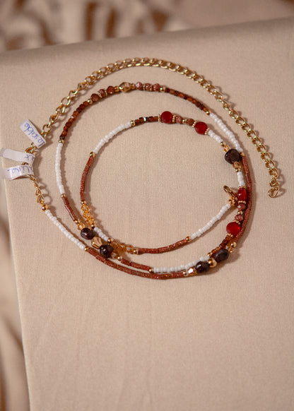 Chaîne de taille acier inoxydable plaqué or, grenat, cornaline, faite main à Montréal. Bijou boho chaleureux pour look solaire, festival, plage.