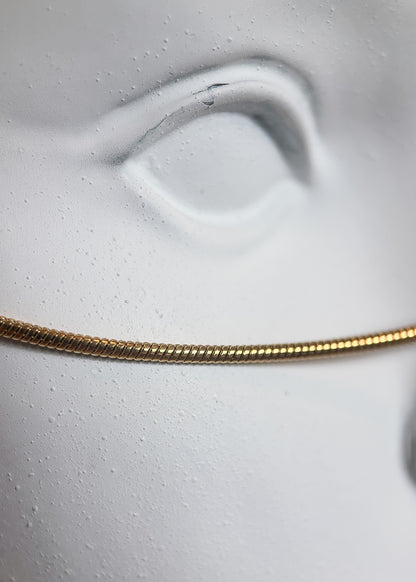 Chaîne de visage acier inoxydable plaqué or, pendentif serpent, fait main à Montréal. Bijou facial mystique pour costume, festival, rave.