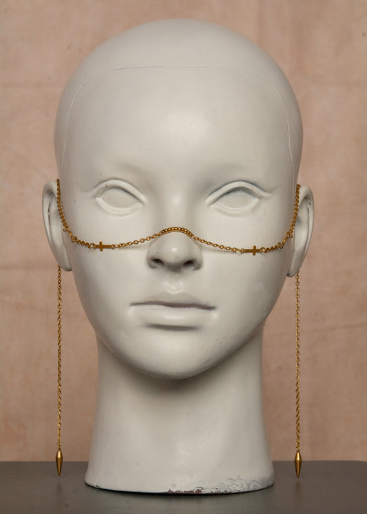 Chaîne de visage mystique en acier inoxydable doré avec petites croix décoratives. Accessoire bohème chic, spirituel et minimaliste, parfait pour festivals, événements et cérémonies.